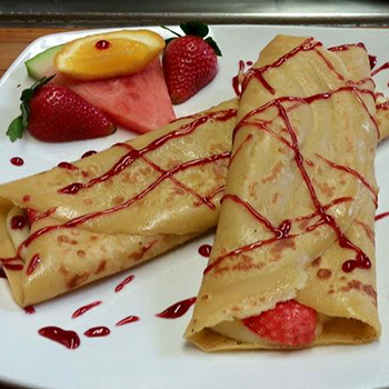 Fruit and custard-filled crepes at Resto Bar Le Blues, Baie-Comeau, QuÃ©bec