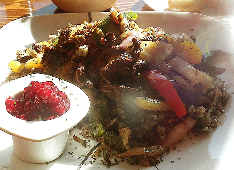 Tea n Bannock's bison stir-fry in wild-rice with vegetables and a side of cranberry sauce