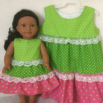 Matching girl's and doll's dresses from All Dolled Up, North Bay, Ontario